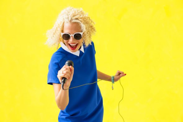 Woman singing with microphone
